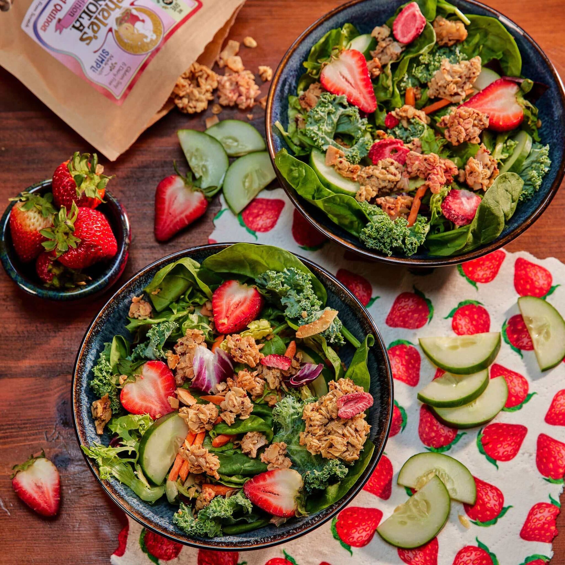 Michele's Limited Edition Strawberry & Red Quinoa Granola over a fresh green salad