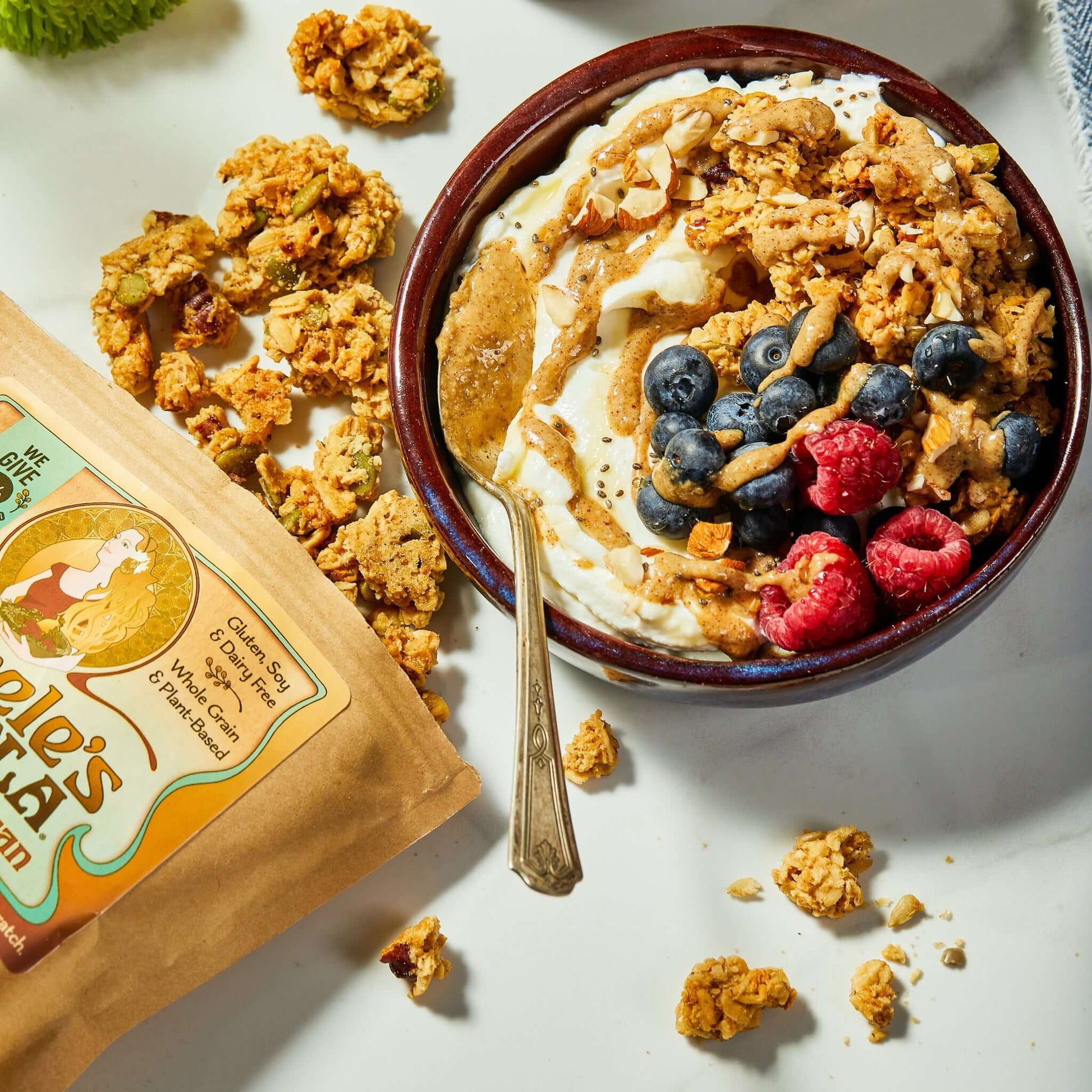 MIchele's Salted Maple Pecan Granola served on a yogurt bowl, a high protein breakfast idea